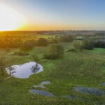 Dunsany Nature Reserve Bionua, Biodiversity Credit, certificate, climate action, rewilded area, aerial view, infographic, climate education, field survey, wildlife, global impact, community, rare plant, conservation area, endangered species, action strategy, slide, reforestation, sapling, CO2 reduction, graph, partner certificate, mitigation brochure, initiative launch, rewilding, biodiversity